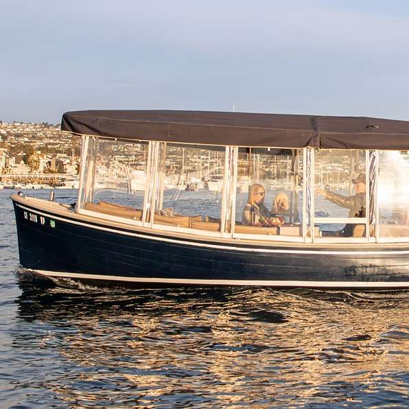 Relax and enjoy a tranquil cruise of Newport Harbor at your own pace in an upscale electric boat from Newport Harbor Boat Rentals in Newport Beach, California